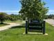 Rosamond Park sign amidst lush greenery, highlighting the community's proximity to recreational areas at 7755 E Quincy Ave # 206, Denver, CO 80237