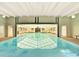 Indoor swimming pool with overhead lighting and clear water, perfect for year-round enjoyment at 7755 E Quincy Ave # 206, Denver, CO 80237