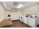 Clean laundry room with several washers and dryers at 7455 E Quincy Ave # 204, Denver, CO 80237