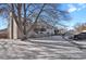 Exterior view of building and yard in winter at 3550 S Harlan # 144, Denver, CO 80235