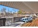 Wooden patio with picnic tables overlooking a pond at 3550 S Harlan # 144, Denver, CO 80235