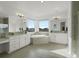 The bright bathroom features double vanities, large mirrors, corner tub and tiled flooring at 22263 Boundstone St, Parker, CO 80138