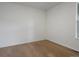 Empty room showcasing hardwood floors, ample natural light, and fresh paint at 22263 Boundstone St, Parker, CO 80138