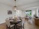 Elegant dining room showcases modern lighting, stylish furnishings, and a seamless transition into the adjacent living space at 22263 Boundstone St, Parker, CO 80138