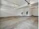 Spacious garage with overhead lighting, concrete floor, and a mounted EV charger at 22263 Boundstone St, Parker, CO 80138