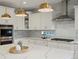 Gourmet kitchen featuring stainless steel appliances, stone countertops, and a stylish backsplash at 22263 Boundstone St, Parker, CO 80138