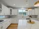 Open kitchen with a large island, modern lighting, and stainless steel appliances at 22263 Boundstone St, Parker, CO 80138