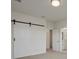 The spacious main bedroom features a sliding barn door and an ensuite bathroom at 22263 Boundstone St, Parker, CO 80138