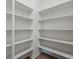 Bright pantry with white shelving offering ample storage space for an organized kitchen at 22263 Boundstone St, Parker, CO 80138