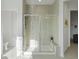 Beautiful bathroom shower with seamless glass doors, tile surround, and built-in bench and shelves at 22263 Boundstone St, Parker, CO 80138