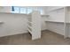 Spacious walk-in closet with built-in shelving and ample storage space for clothing and accessories at 22263 Boundstone St, Parker, CO 80138