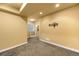 Finished basement area with neutral paint, carpet and recessed lighting offers flexible living space at 15348 W 75Th Pl, Arvada, CO 80007