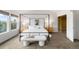 Bright bedroom featuring a canopy bed, soft natural light, and contemporary decor at 15348 W 75Th Pl, Arvada, CO 80007