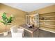 Comfortable home office space with bookshelves and french doors at 15348 W 75Th Pl, Arvada, CO 80007