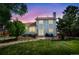 Spacious backyard featuring a lush lawn, mature trees, and a private patio perfect for outdoor entertaining and relaxation at 613 N Brentwood Ct, Castle Rock, CO 80104