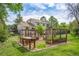 Backyard garden features raised garden beds, manicured lawn, and lush landscaping at 613 N Brentwood Ct, Castle Rock, CO 80104
