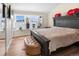 Comfortable bedroom with a large bed, bright windows, and space for relaxation at 613 N Brentwood Ct, Castle Rock, CO 80104