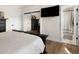 Bedroom featuring a large bed, closet, and access to an en-suite bathroom at 613 N Brentwood Ct, Castle Rock, CO 80104