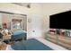Bedroom featuring a large window, closet with mirrored doors, and neutral decor at 613 N Brentwood Ct, Castle Rock, CO 80104
