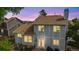 Rear view of lovely two-story home with well-kept landscape and a beautiful evening sky at 613 N Brentwood Ct, Castle Rock, CO 80104