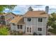 Rear view of lovely two-story home with well-kept landscape, lush green lawn, and a brick patio at 613 N Brentwood Ct, Castle Rock, CO 80104