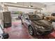 Spacious garage with ample storage space, parking for multiple cars, and access to the street at 613 N Brentwood Ct, Castle Rock, CO 80104