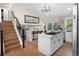 Modern island kitchen with quartz countertops, a breakfast bar, and updated appliances providing style and function at 613 N Brentwood Ct, Castle Rock, CO 80104