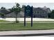 Alpers Farm Park features a basketball court with a basketball hoop and park sign at 6358 S Miller Way, Littleton, CO 80127