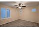 Cozy bedroom with neutral carpet, ample natural light, and a ceiling fan, creating a relaxing ambiance at 6358 S Miller Way, Littleton, CO 80127