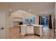 Open-concept kitchen area with a large island, stainless steel appliances, and access to the outdoor deck at 6358 S Miller Way, Littleton, CO 80127