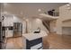 Bright, modern kitchen features stainless steel appliances, quartz countertops, and hardwood floors at 6358 S Miller Way, Littleton, CO 80127