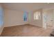 Spacious living room featuring hardwood floors, neutral paint, and abundant natural light through the window at 6358 S Miller Way, Littleton, CO 80127