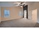 Spacious main bedroom features vaulted ceiling, ceiling fan, carpet, and an ensuite bathroom at 6358 S Miller Way, Littleton, CO 80127