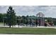 Neighborhood playground with colorful play structures and picnic tables at 6358 S Miller Way, Littleton, CO 80127