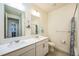 Clean bathroom with double vanity and shower/tub combo at 1680 Rivergate Way, Berthoud, CO 80513