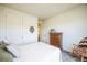 Bright bedroom with double door closet and rocking chair at 1680 Rivergate Way, Berthoud, CO 80513