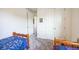 Bedroom with twin beds, carpet flooring, and a large closet at 1680 Rivergate Way, Berthoud, CO 80513