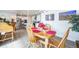 Dining area with wooden table and view into the kitchen at 1680 Rivergate Way, Berthoud, CO 80513