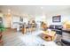Open concept kitchen with island and view to living room at 1680 Rivergate Way, Berthoud, CO 80513
