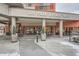 Elegant building entrance at 100 Park Avenue West with outdoor seating and decorative planters at 100 Park W Ave # 201, Denver, CO 80205