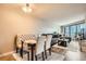 The dining area features tufted chairs and seamless integration into the living space at 100 Park W Ave # 201, Denver, CO 80205
