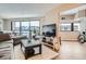 Bright living room with expansive windows offering city views and modern decor at 100 Park W Ave # 201, Denver, CO 80205