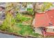 Aerial view showcasing house with patio and green backyard at 6990 Larsh Dr, Denver, CO 80221