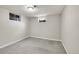 Basement bedroom features carpet floors and small windows; ready for customization at 6990 Larsh Dr, Denver, CO 80221