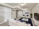 Inviting basement living area with stylish furniture, soft lighting, and a calming atmosphere at 6990 Larsh Dr, Denver, CO 80221
