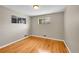 Sunlit bedroom with hardwood floors at 6990 Larsh Dr, Denver, CO 80221