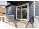 A charming back porch with sliding glass doors offers easy access to outdoor living and entertaining at 13921 Scarlet Sage Ln, Parker, CO 80134