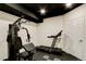 Finished basement featuring gym equipment, providing a dedicated workout area at 13921 Scarlet Sage Ln, Parker, CO 80134