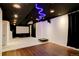 Finished basement featuring a projector, screen, hardwood flooring, and recessed lighting at 13921 Scarlet Sage Ln, Parker, CO 80134