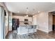 Modern kitchen with stainless steel appliances, island seating, and a bright open layout at 13921 Scarlet Sage Ln, Parker, CO 80134